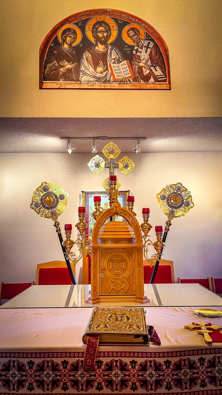 Interior view of St. Nicholas Ukrainian Catholic Parish during Divine Liturgy, capturing the congregation in worship.